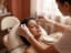 A technician performing eyebrow threading on a reclined client